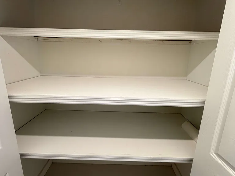 View the storage closet in the first floor bedroom / theater / office with ensuite bathroom as you enter from the garage