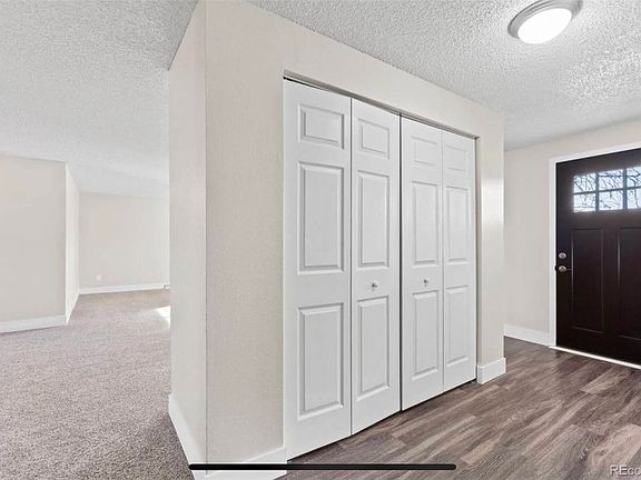 Entry way with washer and dryer unit closet