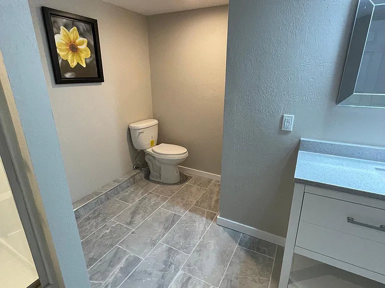 Private stool area lower level bath