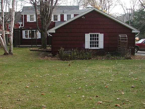 Nice back yard, lots of trees.  That's a rose, herb, and strawberry garden