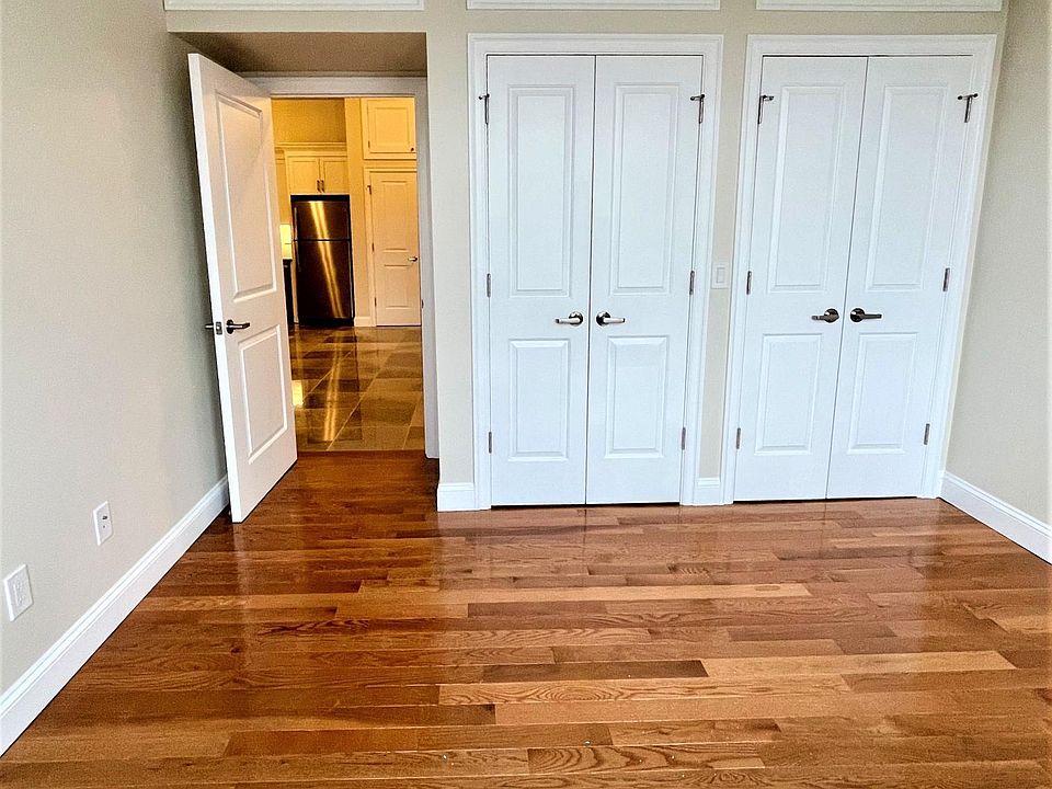 Bedroom 1 with Hardwood Flooring Double Closets and Over head storage. Lots of Natural Light. With Blackout Shades