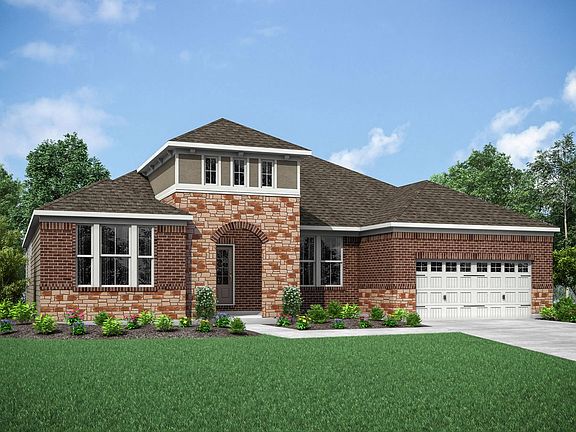 custom home with brick and stone