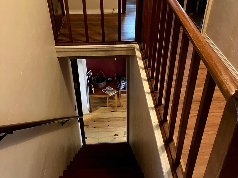 Pictured here is the stairwell, landings & doors - door to the left is bedroom over the downstairs bedroom, middle door is the 3/4 bath, door to the right is to the bedroom over the living room. Caution: Railings do NOT meet child safety guidelines.