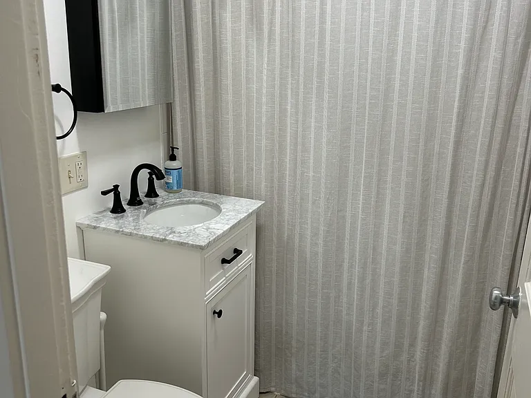 Newly Renovated bathroom with tub.