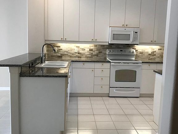 Granite in Kitchen with Marble Backsplash