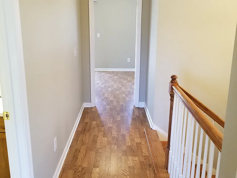 UPSTAIRS HALLWAY LOOKING INTO MASTER BEDROOM ENTRANCE