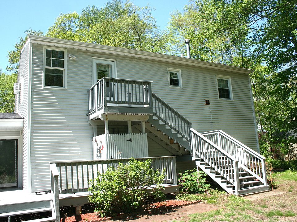 Entrance to apartment is through exterior stairs, lit with a motion sensor light