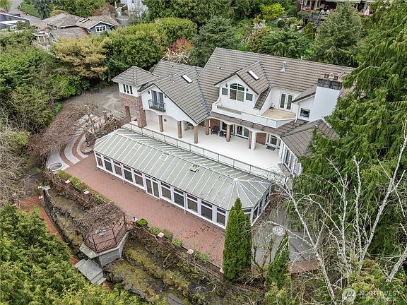 Extensive, custom brickwork handlaid by Spanish artisans. Expansive outdoor living & entertaining space.>