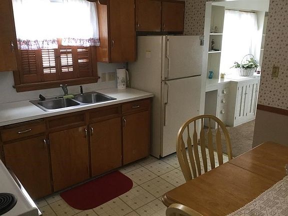 EAT-IN KITCHEN-   ELECTRIC RANGE AND REFRIGERATOR ARE INCLUDED IN THE SALE.