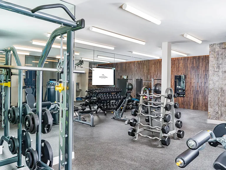 Our club-quality fitness center is equipped with top-notch cardio equipment, a TRX system, and an interactive fitness mirror. Achieve your health goals in a space designed for performance and motivation.