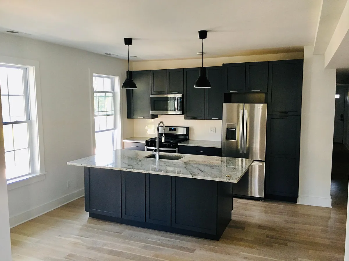 Oversized kitchen island complete with lots of lower cabinet storage - 111 Nash St #3