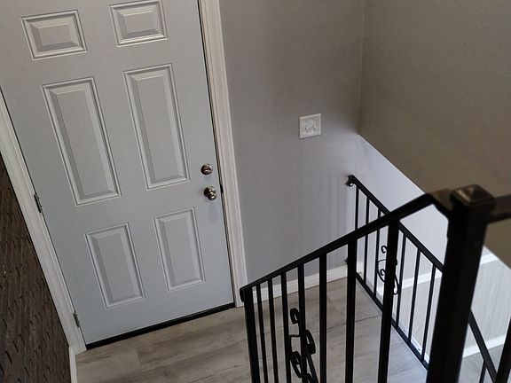 View looking from the upstairs landing to the entrance foyer