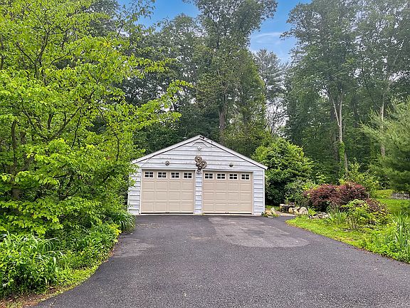 Garage parking - right side 1 car bay and two driveway spots. Landlords reserve left side for storage.