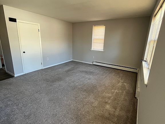 Living room in front of unit. Carpets replaced in the last 5 years - have been cleaned.