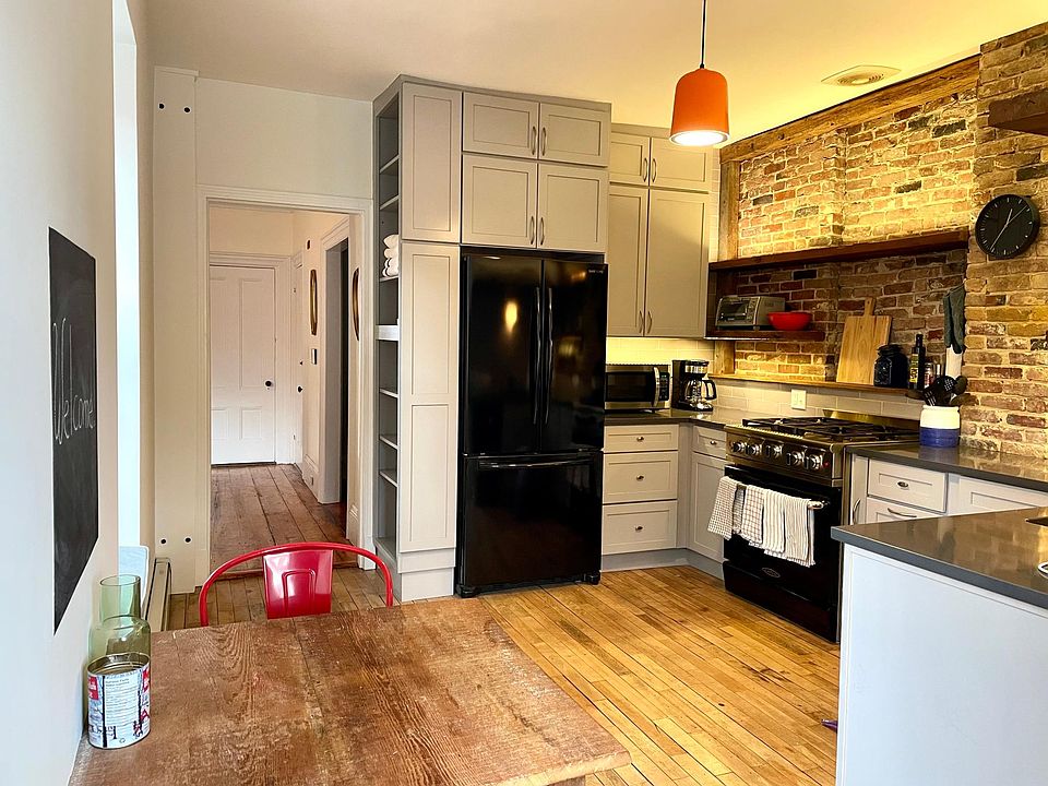 Kitchen includes eating area for two