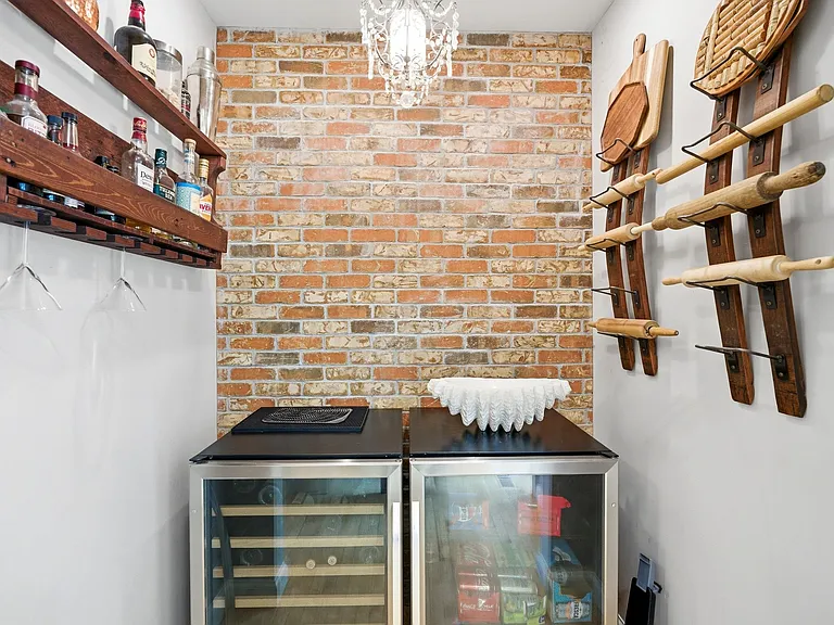 Bar nook with exposed brick wall just off the dining room.