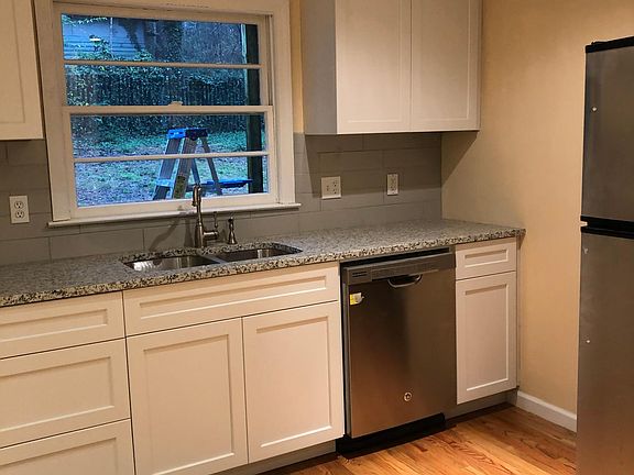 New custom made cabinets. New hardwood floor.