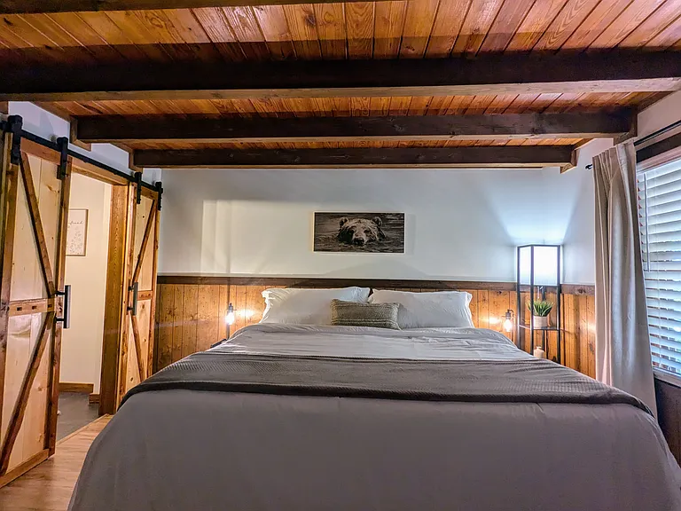 MAIN LEVEL MASTER BEDROOM (sleeps 2): King Bed with Two Charging Station Nightstands