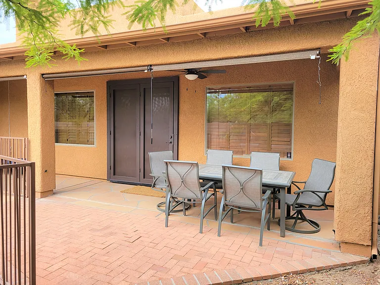 Outdoor eating or studying. Sunshades help keep the home cooler.