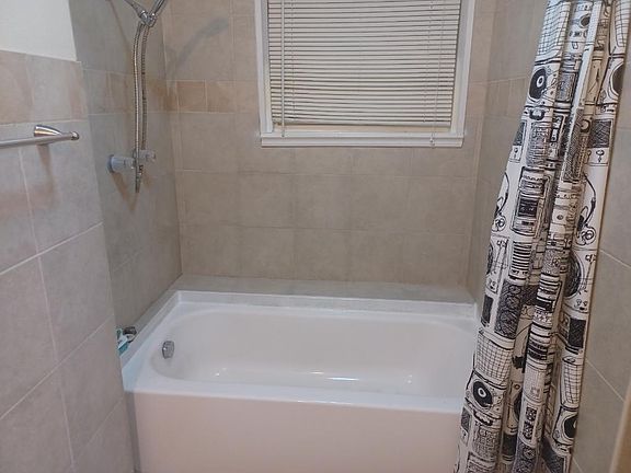 New reglazed tub and shower. New shower curtain and shower head installed at time of move in