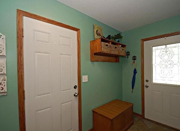 This lovely foyer entrance is just the beginning of this professionally decorated home.