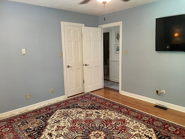 Downstairs right bedroom/office suite with private bathroom and shower