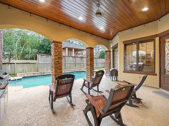 Enjoy swimming in your salt water pool as you relax under the covered back patio with its cool deck