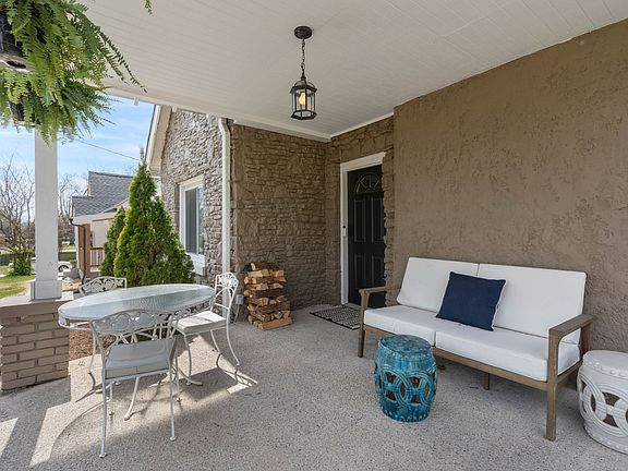 Get your favorite beverage, book and snack ready to enjoy downtime on this covered front porch.