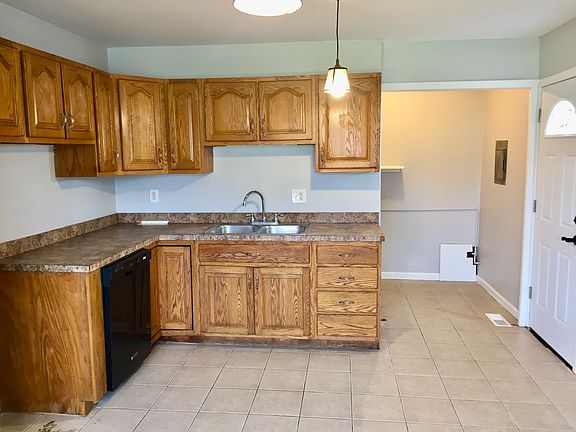 Kitchen with tile floors and dishwasher
