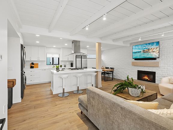 Open concept living, complete with fireplace
