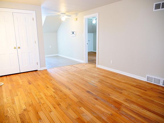 Living room facing towards kitchen and bedroom