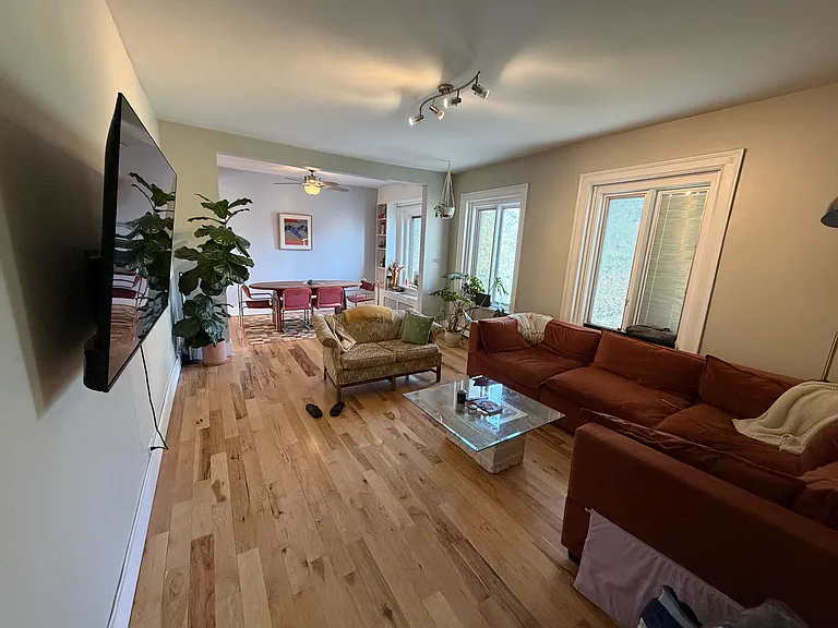 Living room from apartment entrance. Windows face East.