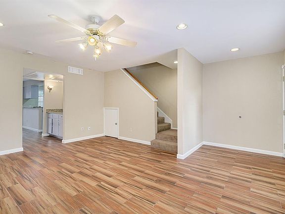 A view of the living room looking toward the staircase