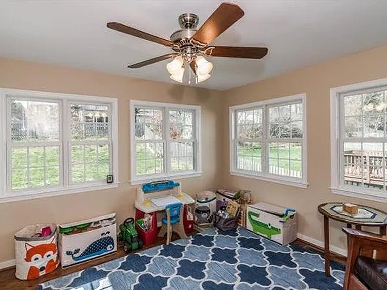 Sun Room with new hardwood flooring - Tenants have used this room as a home office, play room or exercise room.