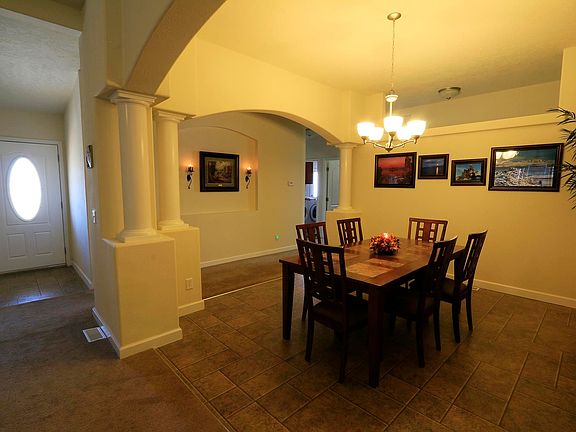 Dining Room with arched entry & columns, front door