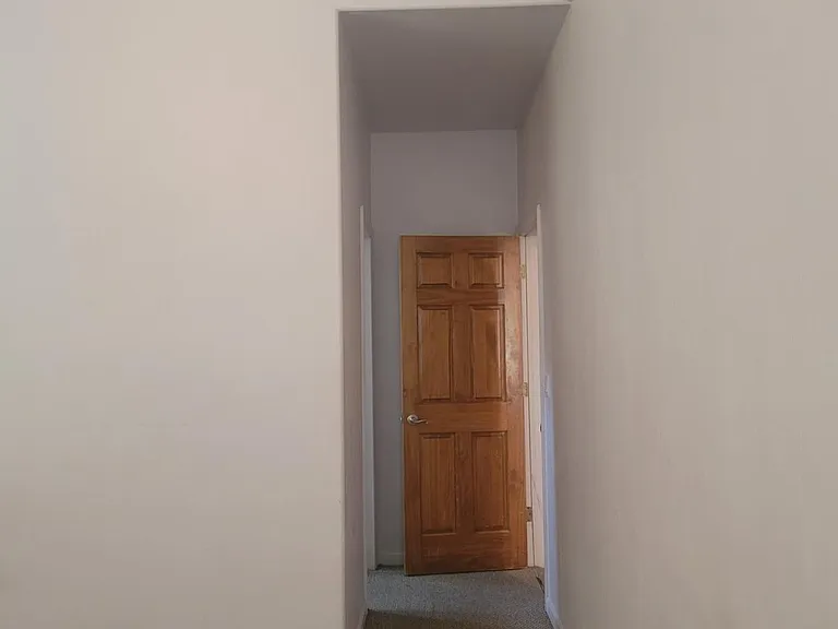 Master bedroom suite hall to bathroom and closet on the left, right is the door going out of the bedroom to living room hall