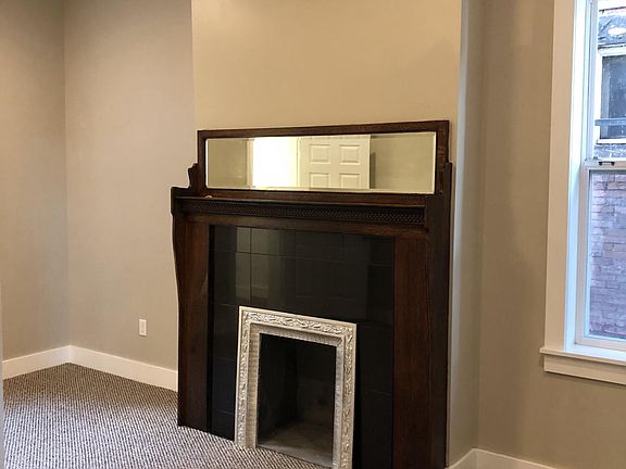 Restored antique fireplace in bedroom