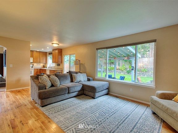 Open concept kitchen and living room with slider to covered outdoor living!