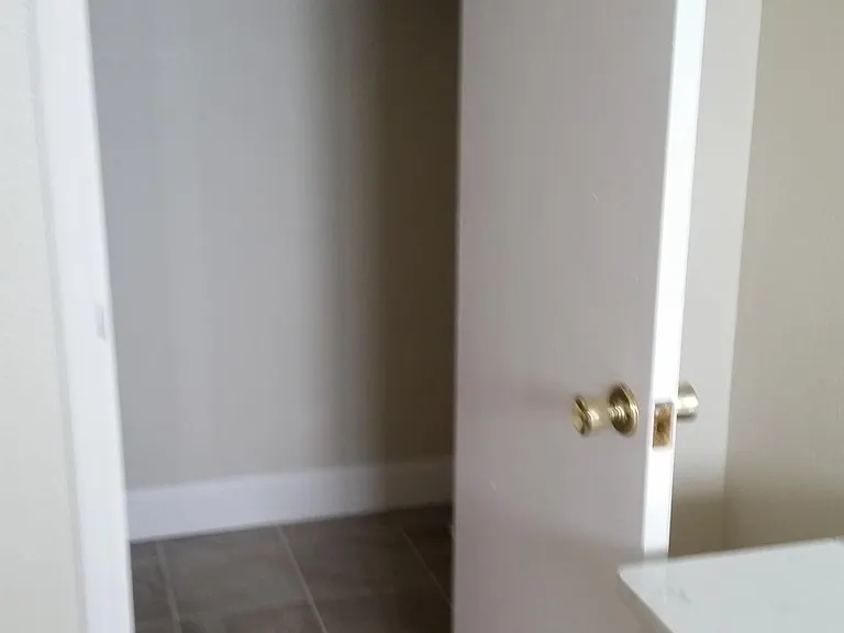 walk in closet in bathroom