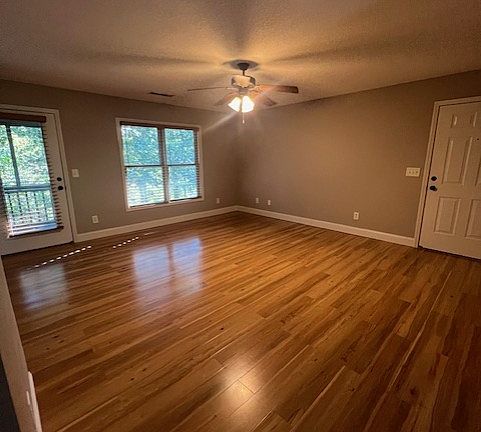 Spacious living room with access to private screened porch
