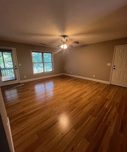 Spacious living room with access to private screened porch