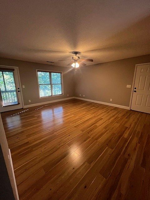 Spacious living room with access to private screened porch