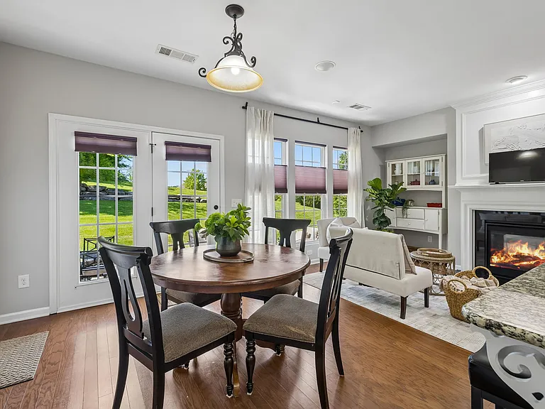 Designed for gathering, the spacious kitchen seamlessly connects to the breakfast area and fireside keeping room, creating an inviting space where family and friends naturally come together.