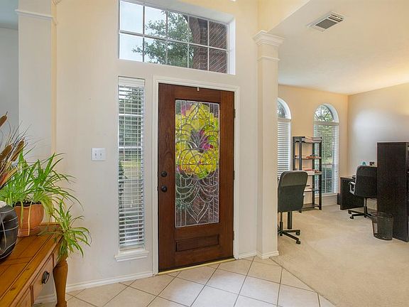 Home office and formal dining room is just off the front entry.