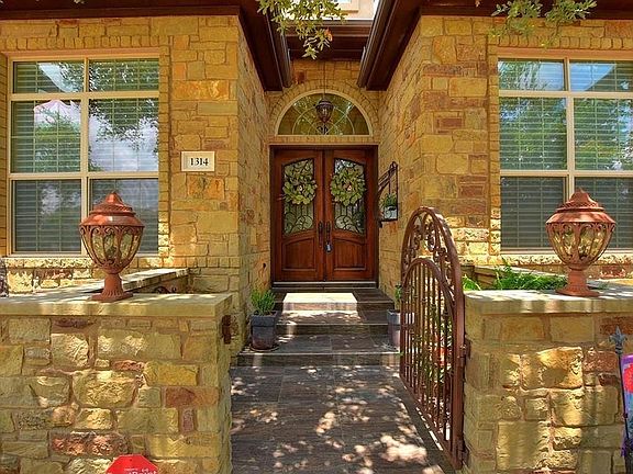 Custom Cochran home: Front door entry. Xeriscape yard front and back