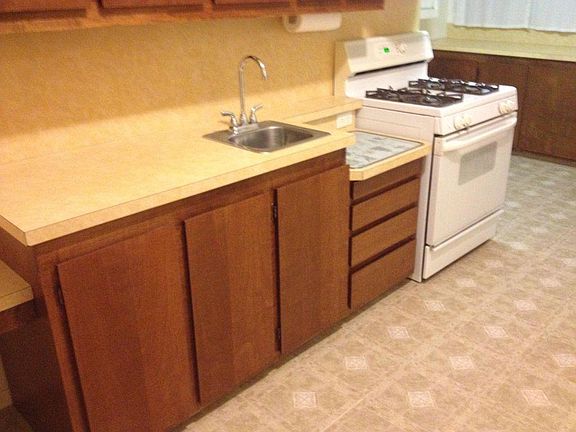 Kitchen has two sinks. One large and 1 small prep sink.