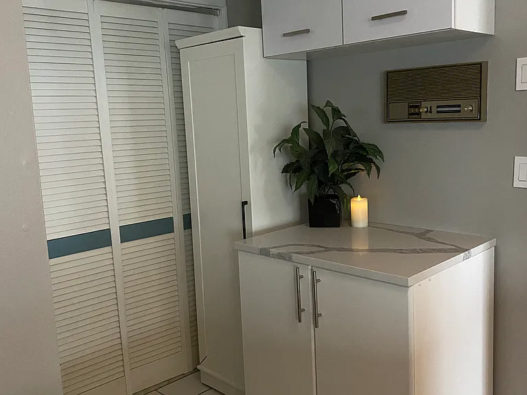 Coffee station and more cabinets added in the kitchen. HVAC in back closet.