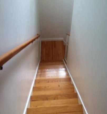 Hardwood stairs to upstairs