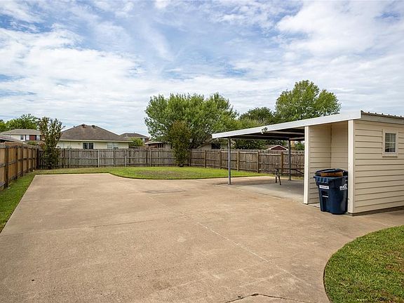 Storage shed for carport
