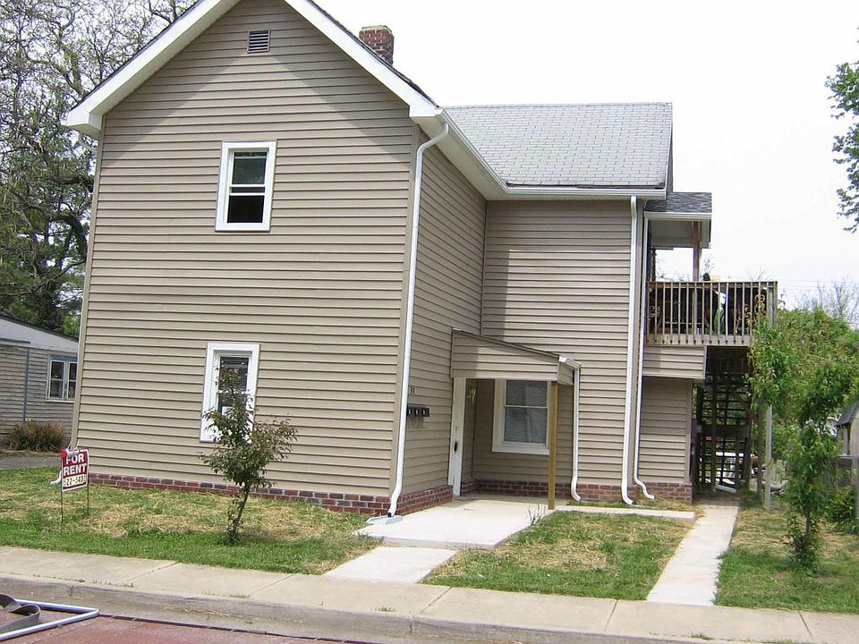 Front of building. Covered front porch entry.
